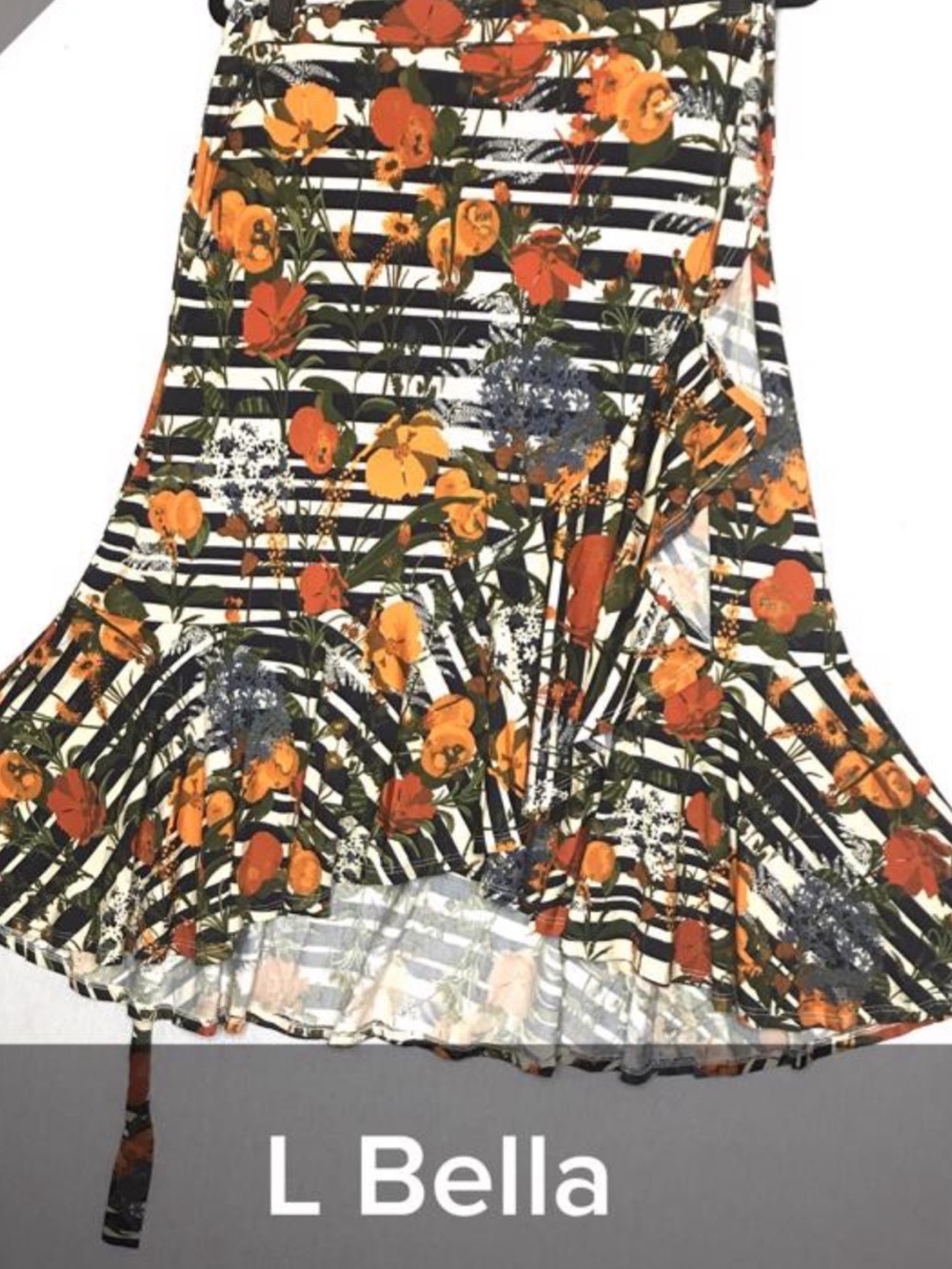 NWT-The Bella is an a-line wrap skirt with a flirty ruffled hemline.SZ L